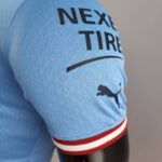 Camiseta Manchester City Primera Equipación 2022-2023 Versión jugador hombro