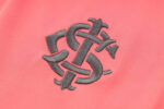 Escudo del chándal Coral del Internacional 2022-2023