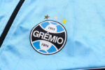 Escudo del chándal celeste del Gremio FBPA 2022-2023 Escudo del chándal celeste del Gremio FBPA 2022-2023