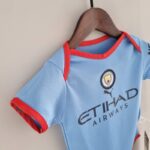 Body del Manchester City primera equipación 2022-2023 lateral Body del Manchester City primera equipación 2022-2023 lateral