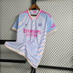 camiseta arsenal stella azul rosa frontal camiseta arsenal stella azul rosa frontal