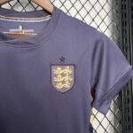 CAMISETA INGLATERRA MUJER SEGUNDA EQUIPACION 24 25 ESCUDO