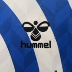 camiseta malaga 2025 logo