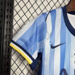 Camiseta-segunda-equipacion-niños-2024-2025-conjunto-puño-derecho Camiseta-segunda-equipacion-niños-2024-2025-conjunto-puño-derecho