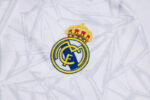 Chandal Real Madrid Blanco y Negro 2024-2025 logo