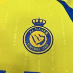 camiseta-al-nassr-primera-equipacion-2024-2025-escudo camiseta-al-nassr-primera-equipacion-2024-2025-escudo