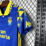 equipacion UD Las Palmas 2024-2025 Segunda Equipación Niños puño izquierdo