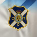 Camiseta Tenerife Primera Equipacion 2024-2025 logo Camiseta Tenerife Primera Equipacion 2024-2025 logo
