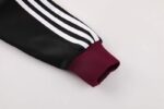 conjunto-chandal-ajax-2024-2025-puño-izquierdo
