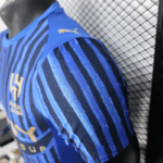 camiseta-Al-Hilal-primera-equipacion-version-jugador-2025-2026-puño-izquierdo