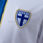 camiseta-filandia-primera-equipacion-2026-escudo