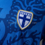 camiseta-filandia-segunda-equipacion-2026-escudo