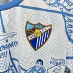 camiseta-málaga-edicion-especial-2025-2026-escudo