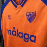 camiseta-malaga-tercera-equipacion-2025-2026-escudo camiseta-malaga-tercera-equipacion-2025-2026-escudo