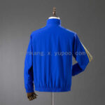 cortaviento-real-madrid-reversible-azul-y-amarillo-2025-2026-parte-trasera cortaviento-real-madrid-reversible-azul-y-amarillo-2025-2026-parte-trasera