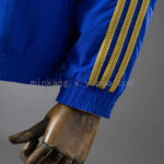 cortaviento-real-madrid-reversible-azul-y-amarillo-2025-2026-puño cortaviento-real-madrid-reversible-azul-y-amarillo-2025-2026-puño