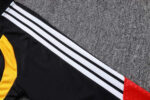 chandal-alemania-negro-rojo-cremallera-baja-2026-2027-hombro chandal-alemania-negro-rojo-cremallera-baja-2026-2027-hombro