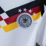 body-de-bebe-alemania-primera-equipacion-2026-2027-escudo