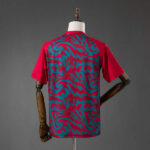 camiseta-portugal-calentamiento-rojo-2026-parte-trasera camiseta-portugal-calentamiento-rojo-2026-parte-trasera